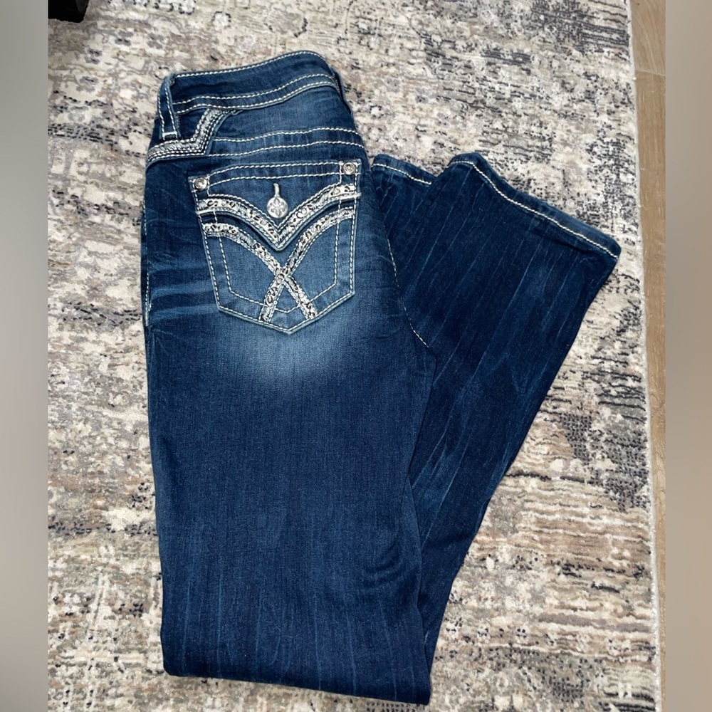 Miss Me mid-rise tailored boot jeans.